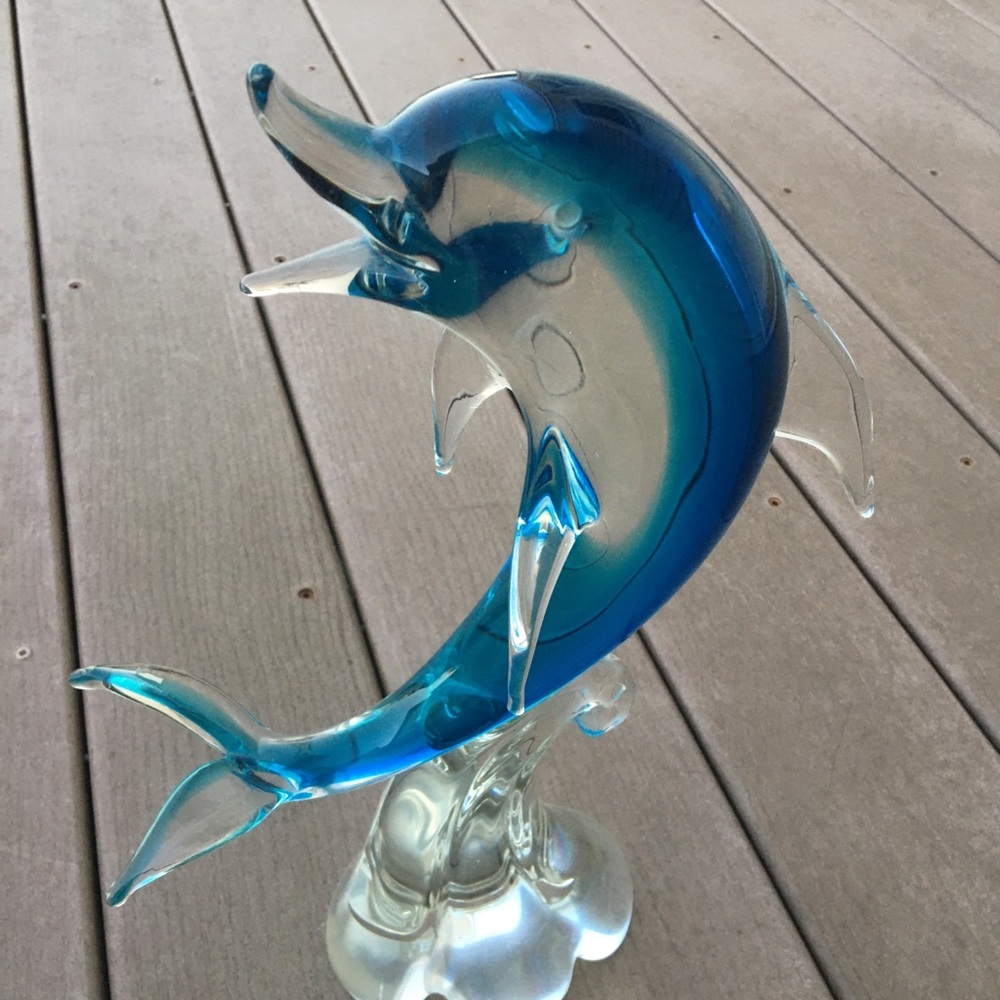 Glass Dolphin riding a wave
